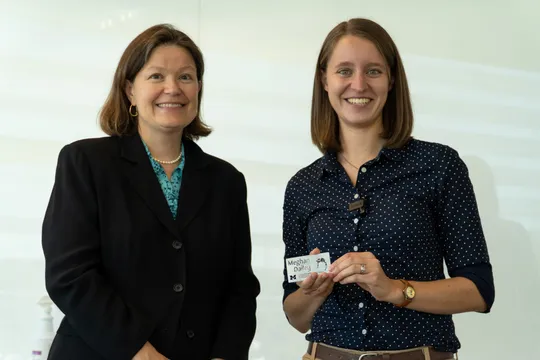 Professor Dawn Tilbury presents Meghan Dailey with a gift.