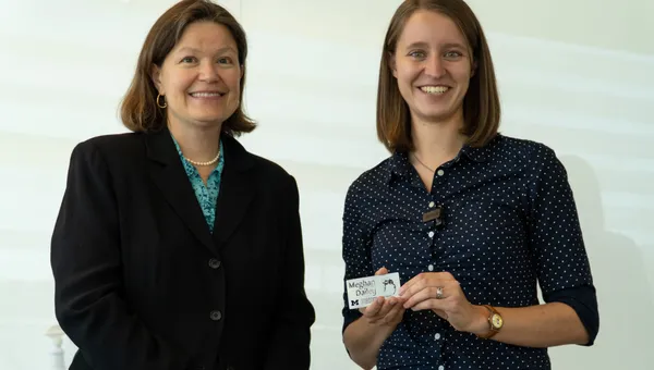 Professor Dawn Tilbury presents Meghan Dailey with a gift.