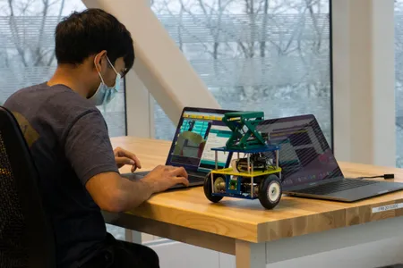 A student works on robot in ROB 103