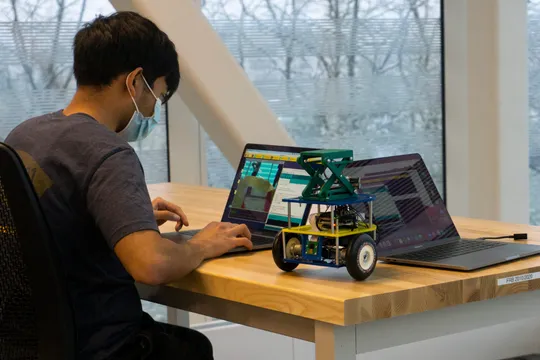 A student works on robot in ROB 103
