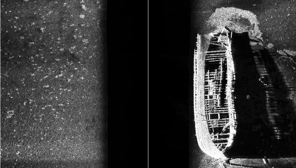 A black and white sonar image of a sunken ship.
