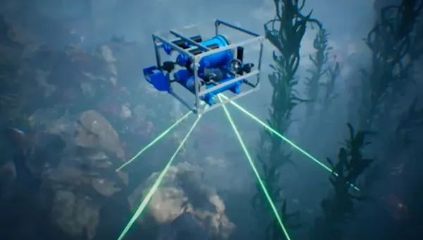 A roboticist presenting to a group of students.