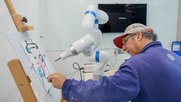 Artist Adnan Charara paints with a robot arm programmed to collaborate on artwork.