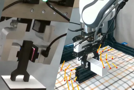 various tools on the end of a robot arm being tested, such as a spatula, sponge, and wrench.