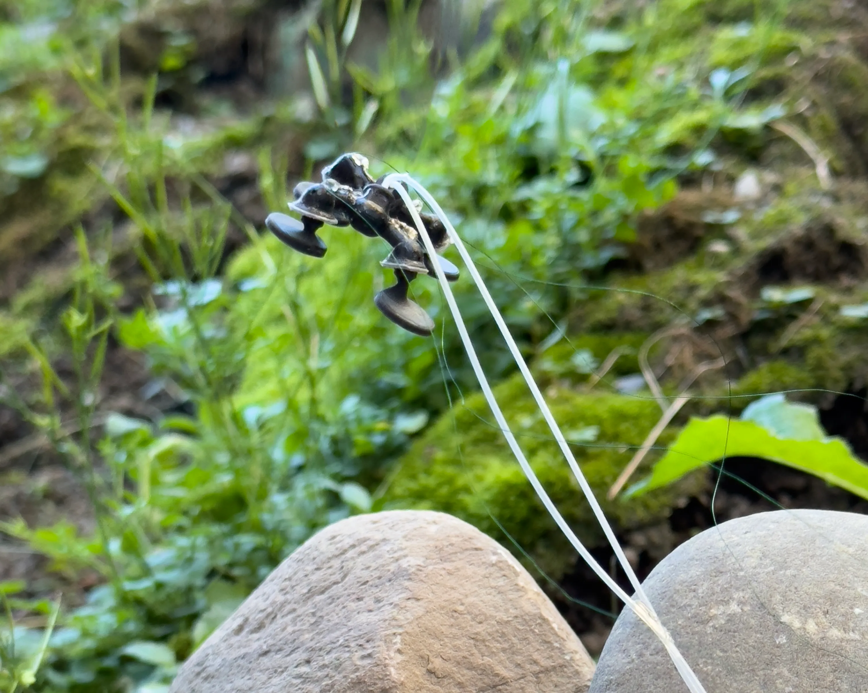 A quadruped insect-scale robot jumps over terrain with soft actuators.