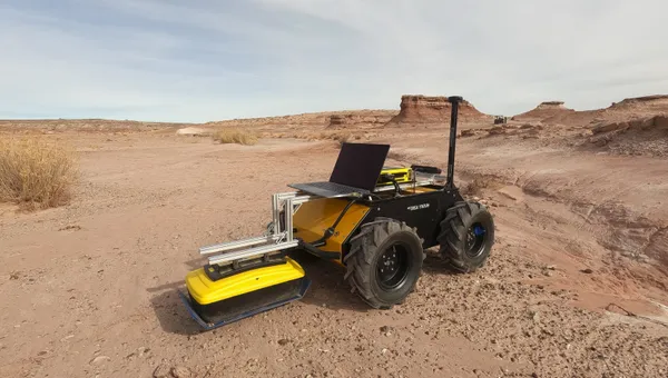 A four-wheel Clearpath Husky robot with a ground penetrating radar attached moves in stark Utah desert.