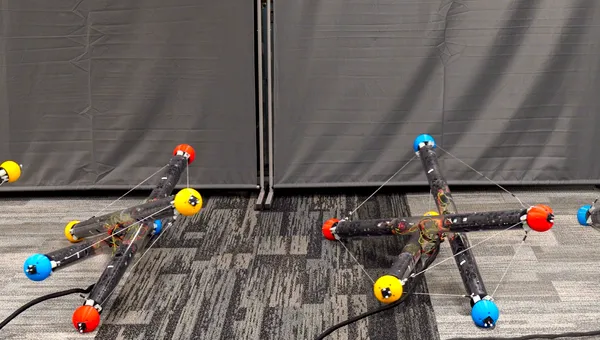 A robot made of three tubes and cables connecting them tumbles across the floor in different arrangements in this composite image.